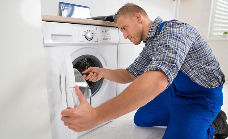 technician installing washing machine