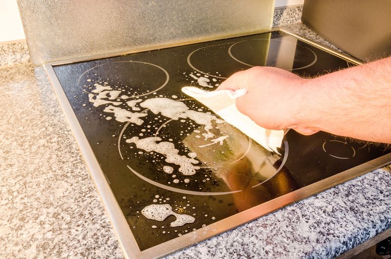 cleaning stove top from spills